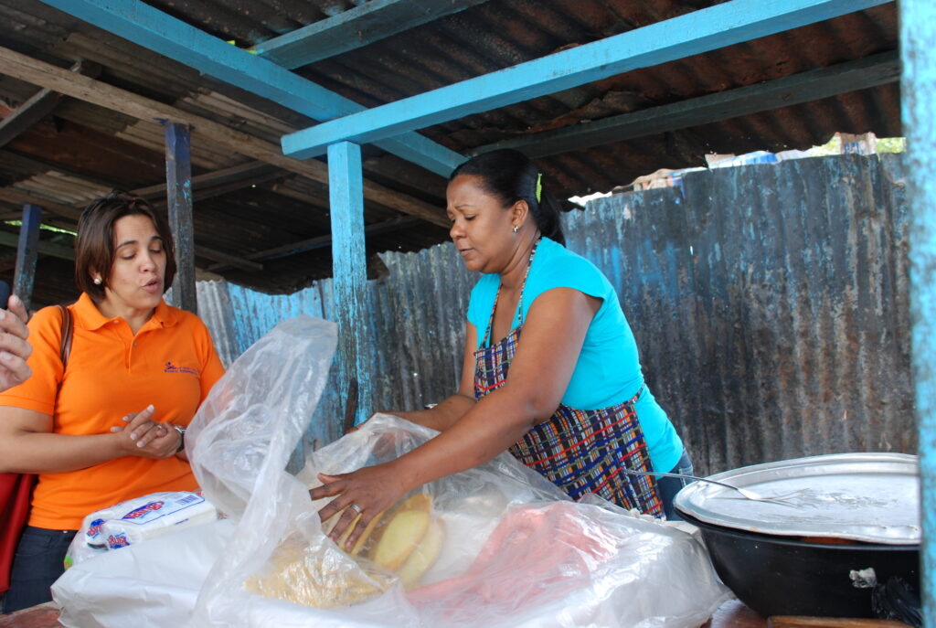 DominicanRepublic 2012 ADOPEM client Skewering food w Meky 1